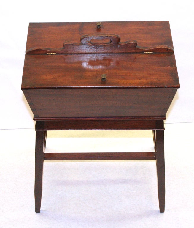 Very nice mahogany sewing box on stand. Very adaptable for many uses. Nice next to a chair or couch. Two sided compartments for your eyeglasses, slippers or ??????