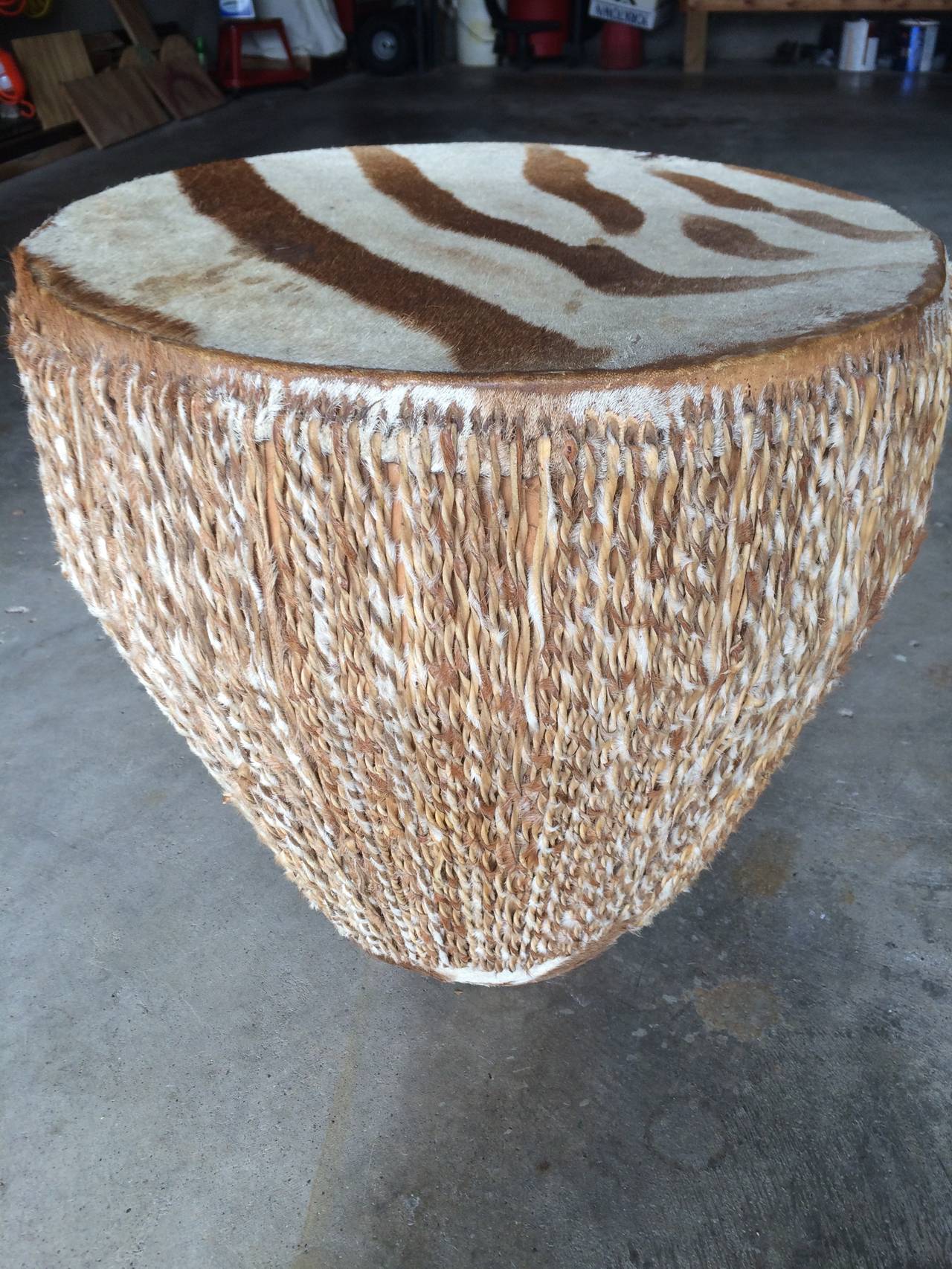 Beautiful pair of African zebra drums. Great side table or beat it! Great condition, beautiful patina.

One is 14