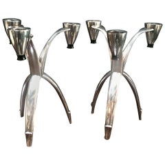 Pair of tri-pod silver community candle sticks