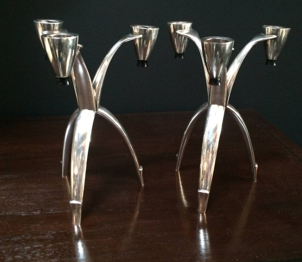 Modern silver three legged and very sexy candle sticks with black detail at tip of each candle holder and leg detail - perfect for dining or on the mantle