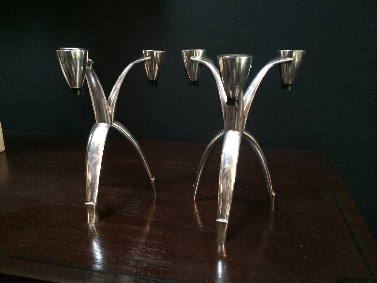 Pair of tri-pod silver community candle sticks In Excellent Condition In Los Angeles, CA