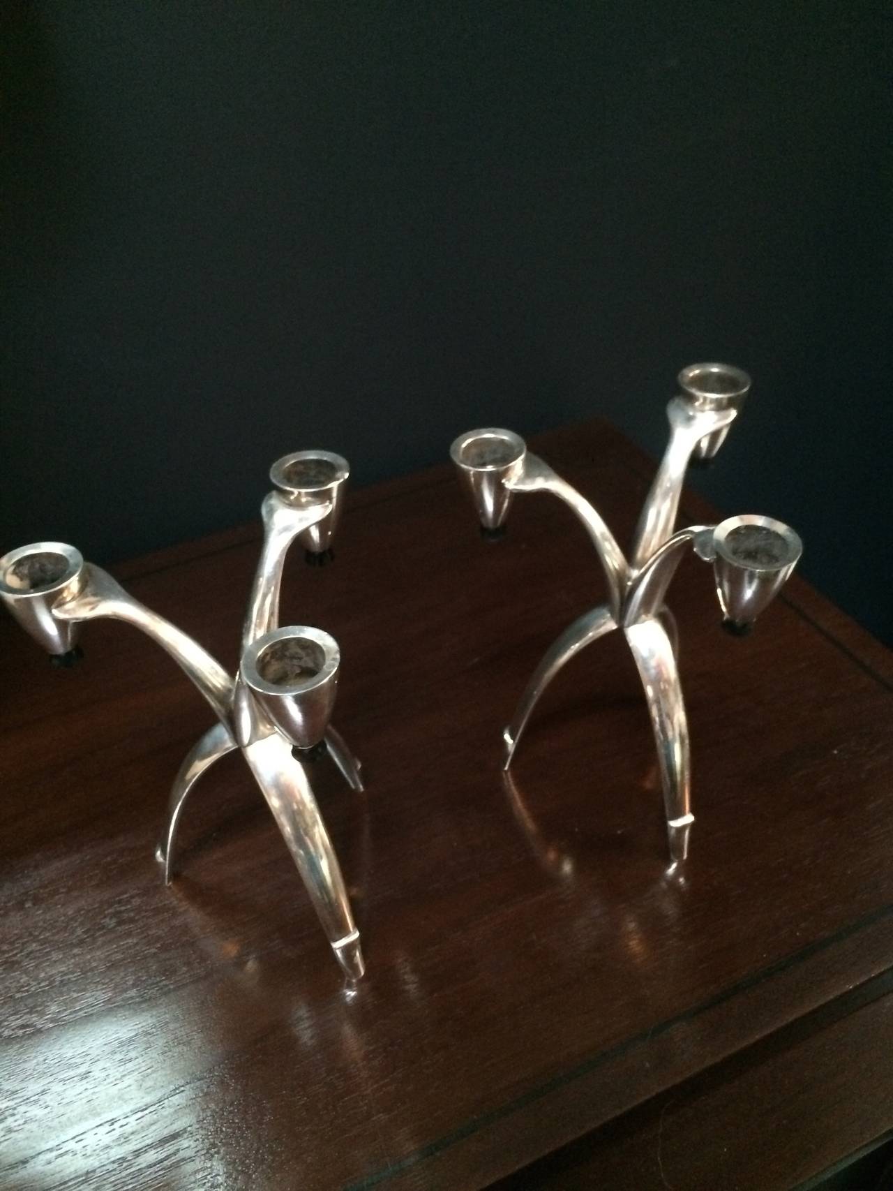 American Pair of tri-pod silver community candle sticks