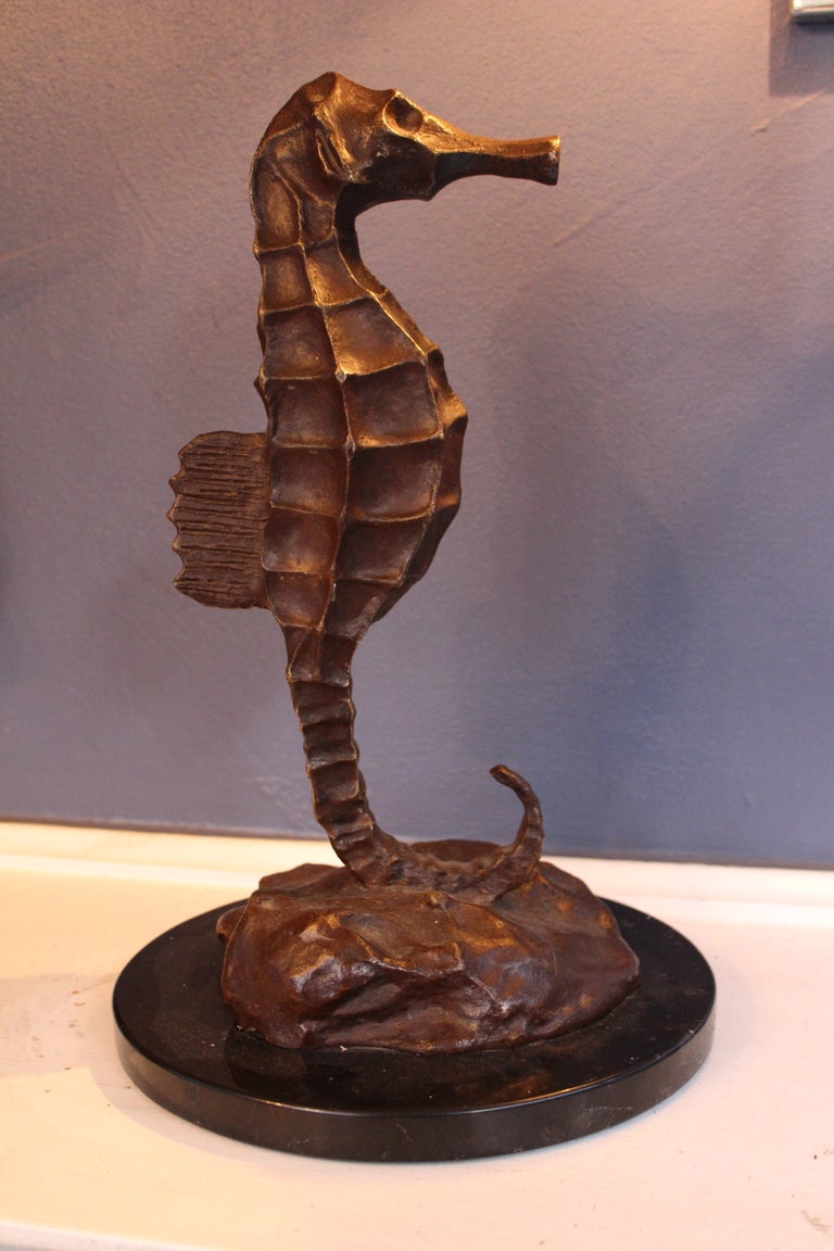 Beautifully sculpted bronze seahorse on marble base.