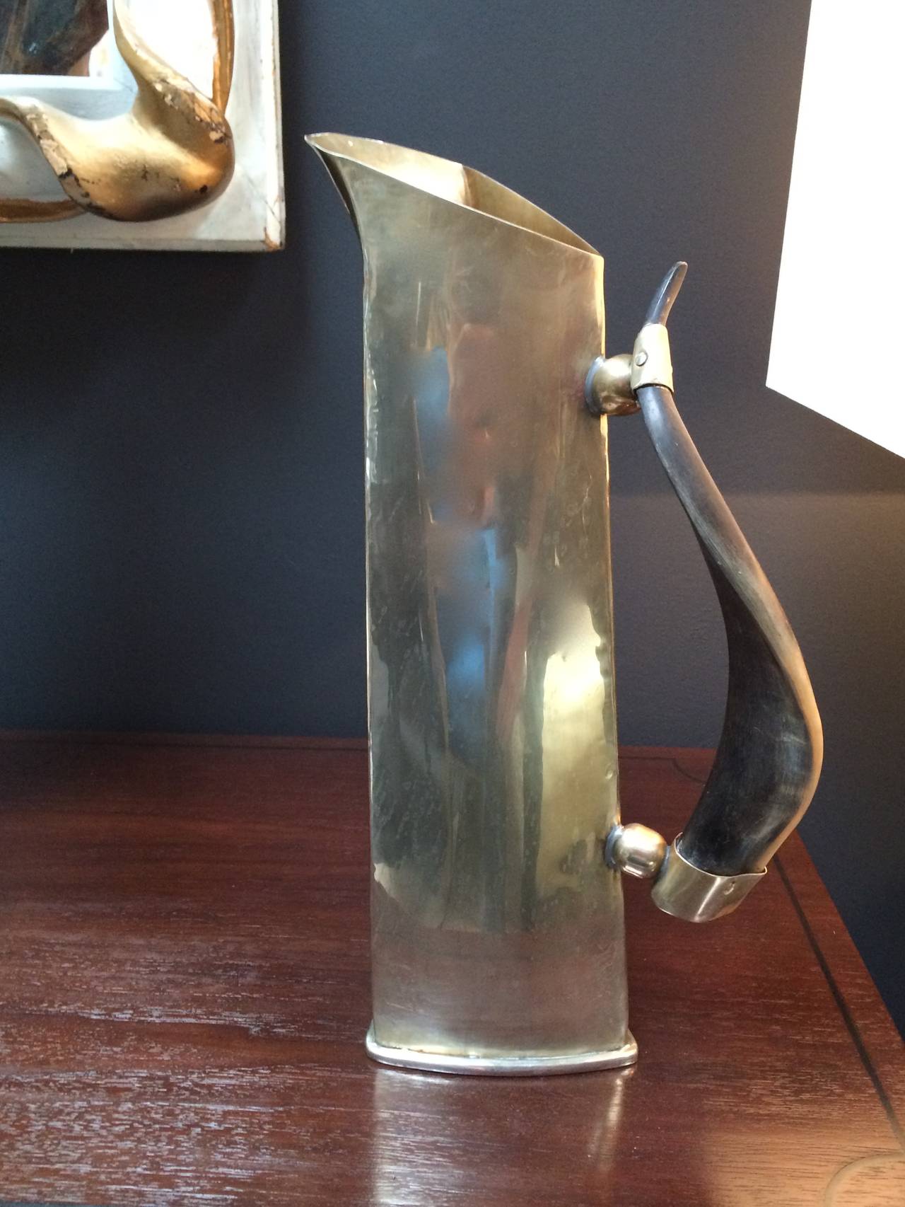 Beautiful and tall silver plate pitcher with bone handle in the manner of Puiforcat. Stunning serving piece or use as decor, height with a statement.