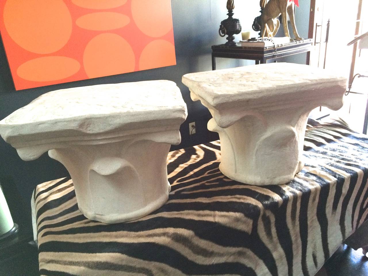 This pair is from a prominent music producers Malibu Estate.

The molded stone like tables are perfect for outdoor or indoor use. The capital inspired style is perfect for any interior or exterior room. The top is large and flat enough to use as