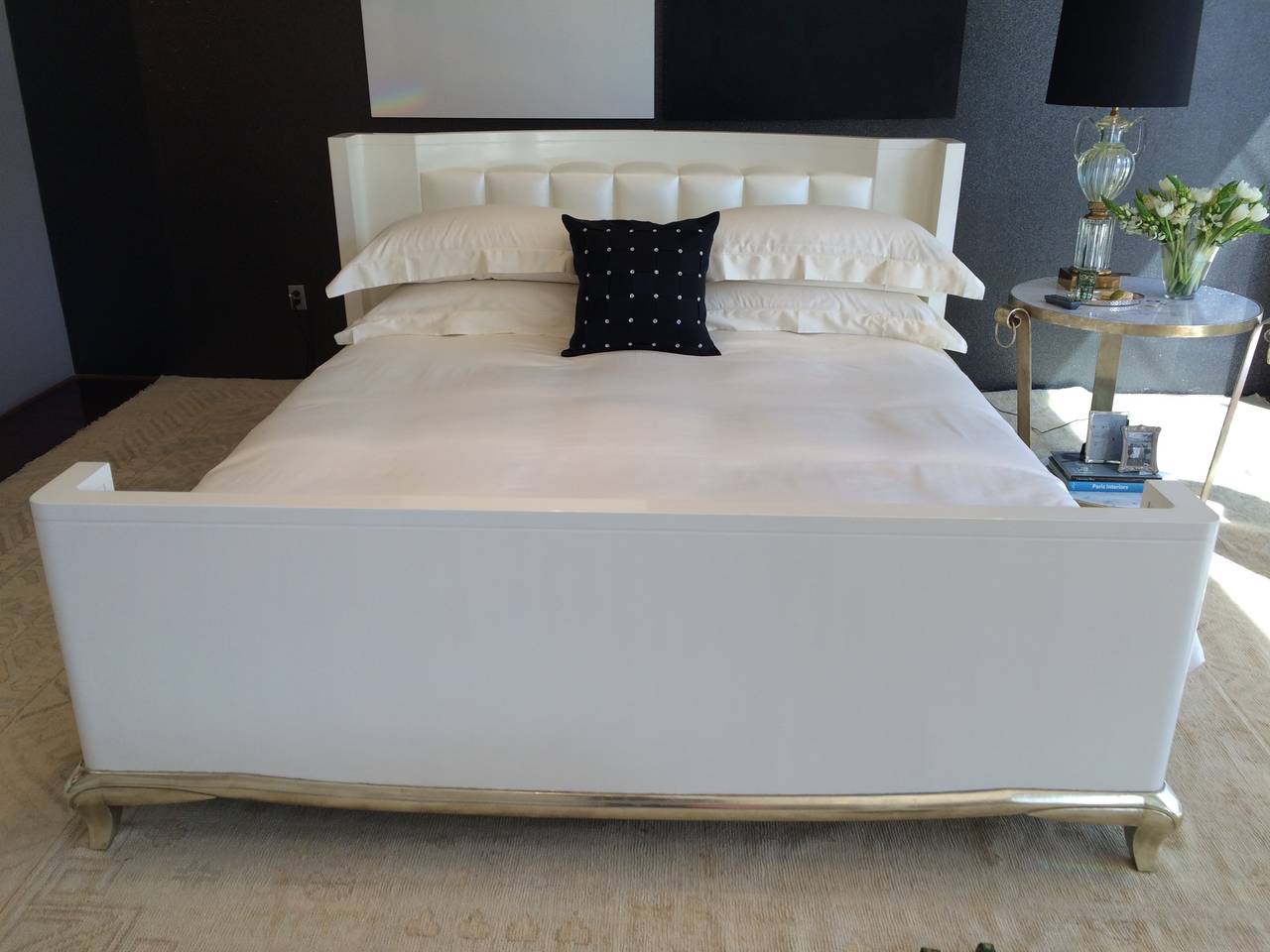 Solid maple bed in gesso and lacquer with white gold leaf carved surround base or feet.
Satin look vinyl upholstered headboard.