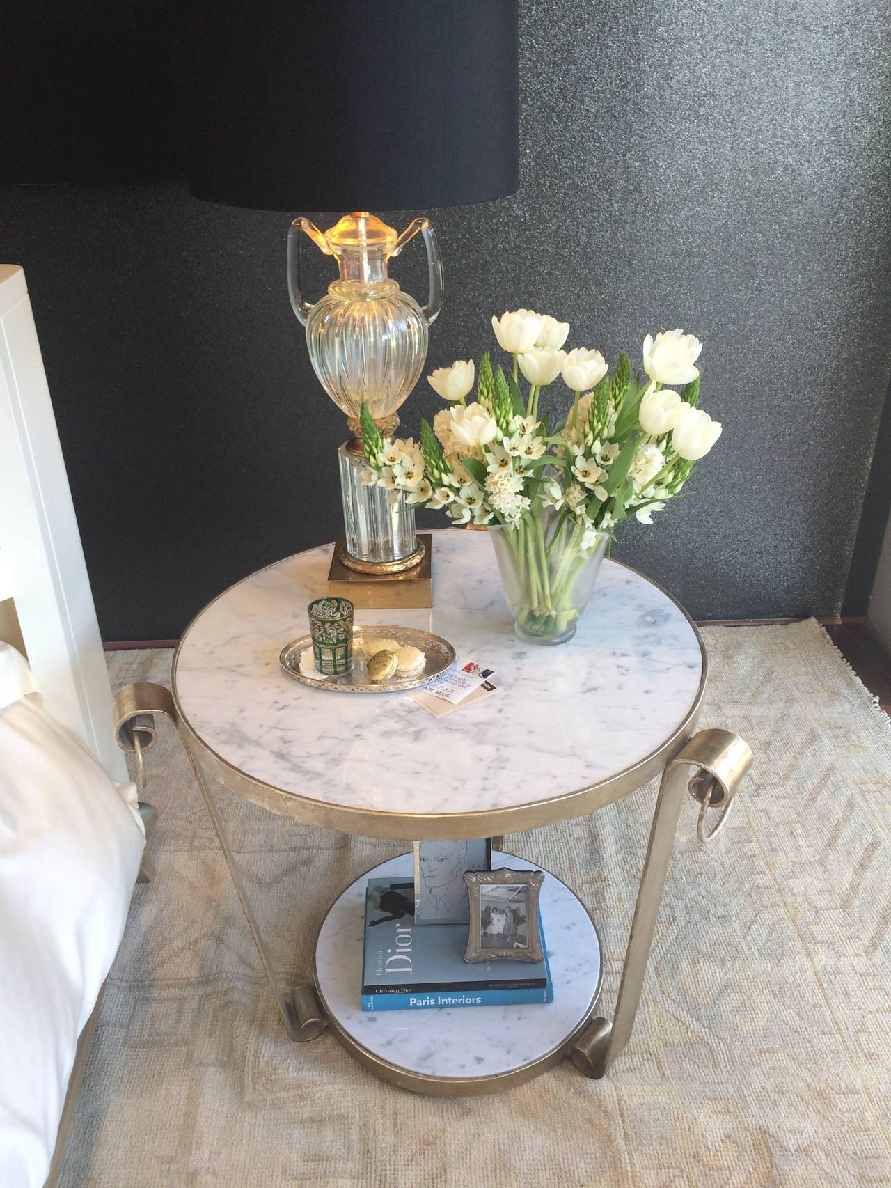 Wrought iron side table with antiqued white gold leaf finish and marble. Perfect for great room, den, bedroom or could be used outdoors.