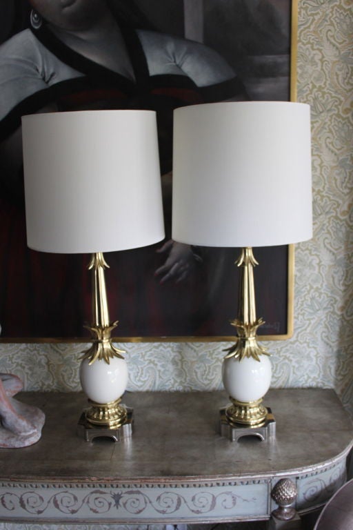 Pair of Ostrich Egg Lamps in the Manner of Tommy Parzinger.  These lamps have been plated  Brass / Bases in Nickel.  The lamps are re-wired