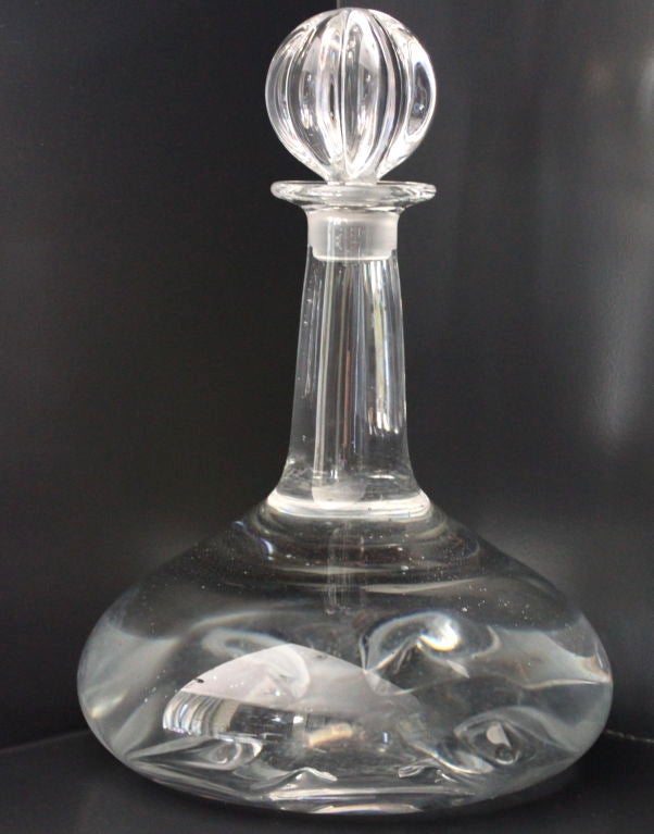 Orrefors crystal decanter signed on bottom, flower shaped thumb printing on bottom.