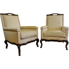 Pair of off white pony skin chairs with hoof detail leg