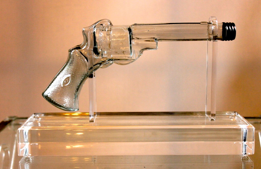 This is a vintage life sized gun with silver screw top - the gun could be filled with liquid or powder?  Custom acrylic stand turns this conversation piece into a museum piece - a wonderful decorative item