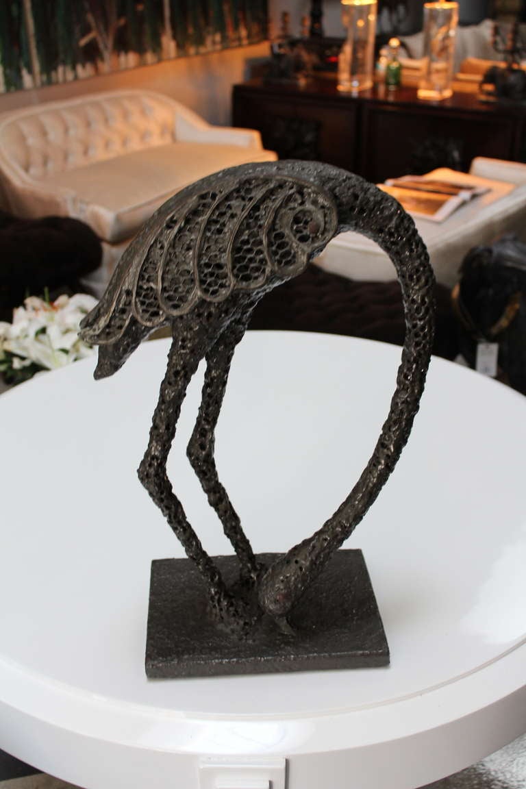 Vintage, unique, flamingo sculpture composed of metal mesh and coated with bronze or deep olive green resin. Piece is light weight but, has the appearance of cast bronze.