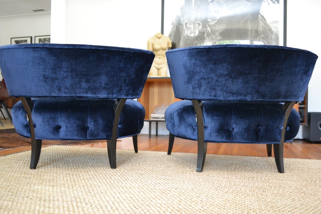 Pair of original chairs by Billy Haines.  The chairs have been reupholstered in blue velvet with new finish to the wood.