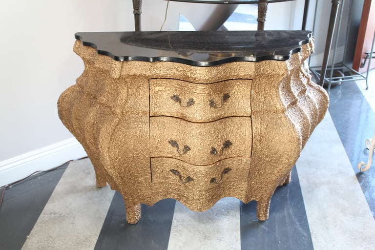 This three drawer commode is an absolutely unique piece - something Alice, no doubt, carried back from her visit to Wonderland! The cantaloupe-like finish is fun, precarious and sophisticated - a wonderful addition to any room worth chatting about!.