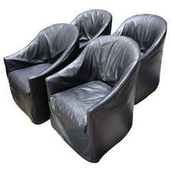 Four Slip Covered chairs in the manner of Phillipe Stark