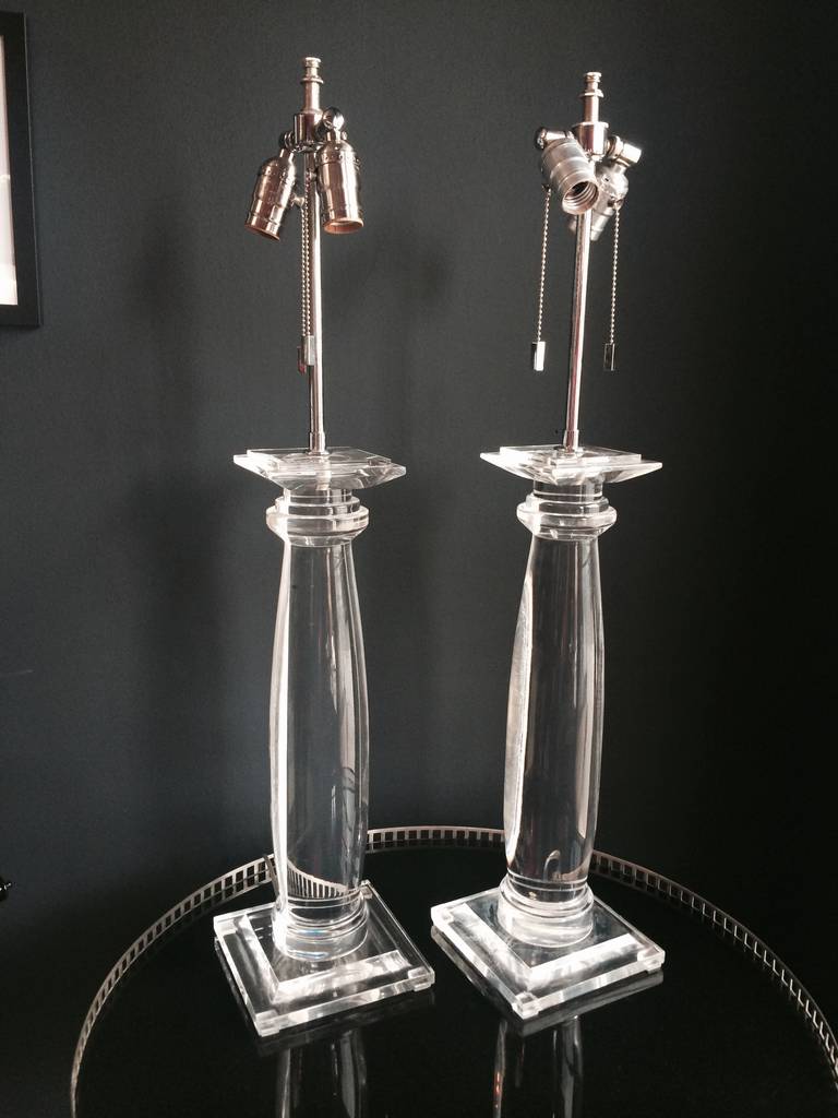 Stunning in both design and simplicity, Karl Springer Lucite table lamps.
This pair could easily work in any room.