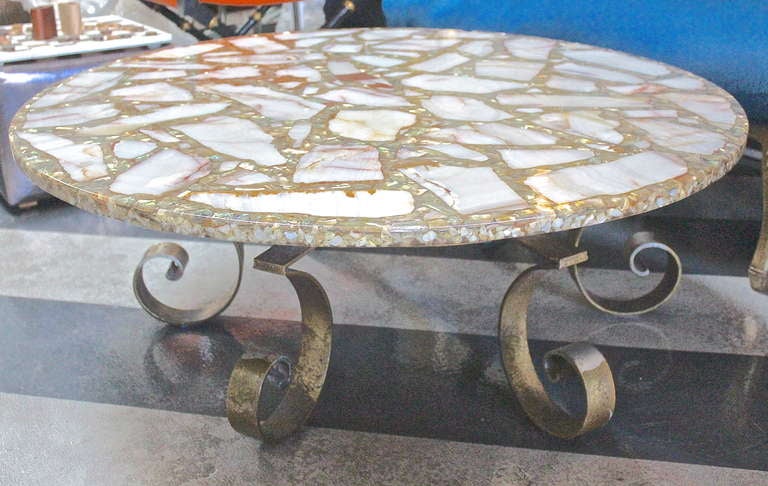 Beautifully crafted, inlaid onyx and abalone shell coffee table. InIaid with a 1