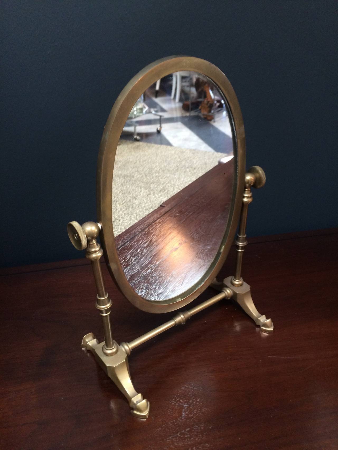Lovely mirror on the smaller side for a mens dressing table - Industrial look to the brass base and fittings.