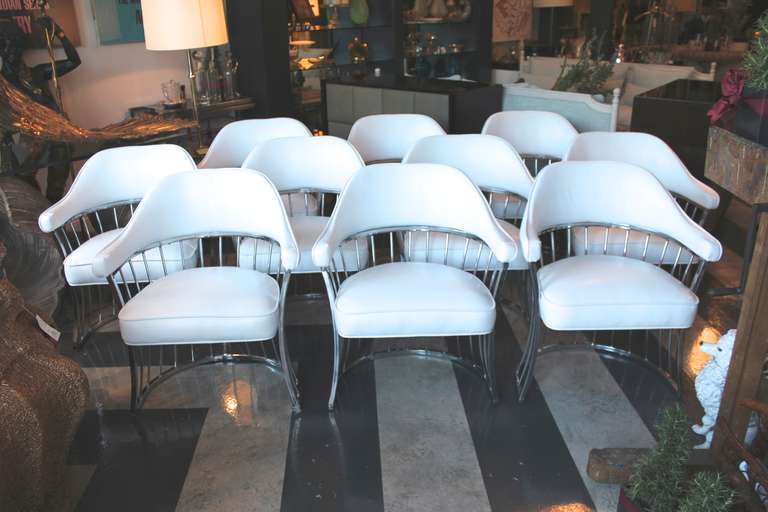 Four chairs of ten remaining chrome craft chairs upholstered in white vinyl - Modern, sexy, durable - Having the ability to seat many chic friends all at once. Brilliant!  Get them while they are hot.