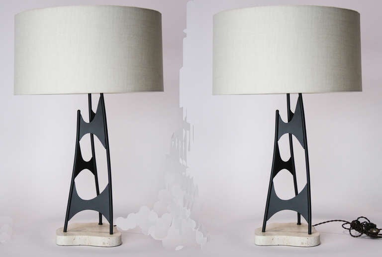 Pair of contemporary abstract form lamps of painted steel with travertine marble bases, custom made in 2011 by noted Southern California metalsmith Laverne Carrol after a design by Mauricio Tempestini.