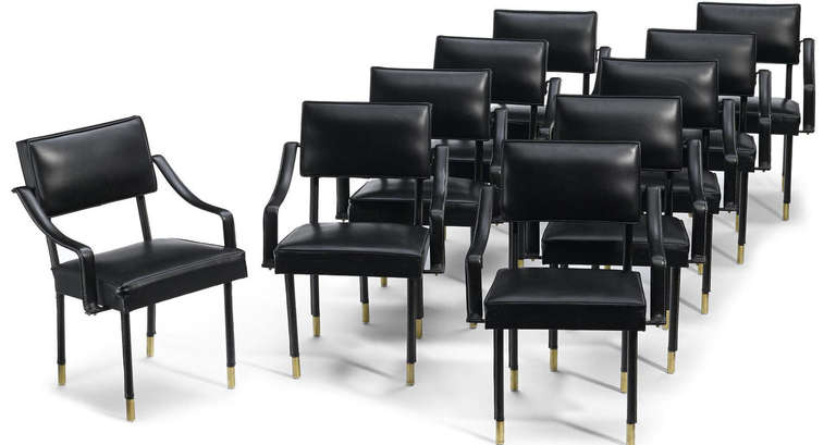 A very nice set of 10 Jacques Adnet armchairs with black leather covered steel frame with brass sabot. Provenance, Wright Important Design, May 18, 2008, lot 112.