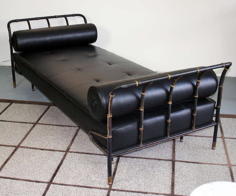 Lovely and rare daybed by Jacques Adnet, circa 1940's in leather with brass accents. Stitched leather frame retains the original leather and shows lovely patina. The brass has a warm patina. the bed and cushions have been professionally
