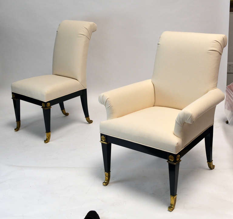 Set of 8 neo-classical Mastercraft Dining Chairs. Black lacquered frame with bronze accents. Reupholstered in muslin. 2 Arm and 6 Side Chairs.