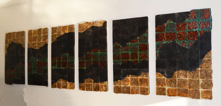 An amazing set of six Raku pottery wall panels. Depicting a stream flowing between golden hills, each panel is comprised of individual tiles. Those on the top and bottom edges of each panel have a free-form edge. The piece is signed on one panel, V.