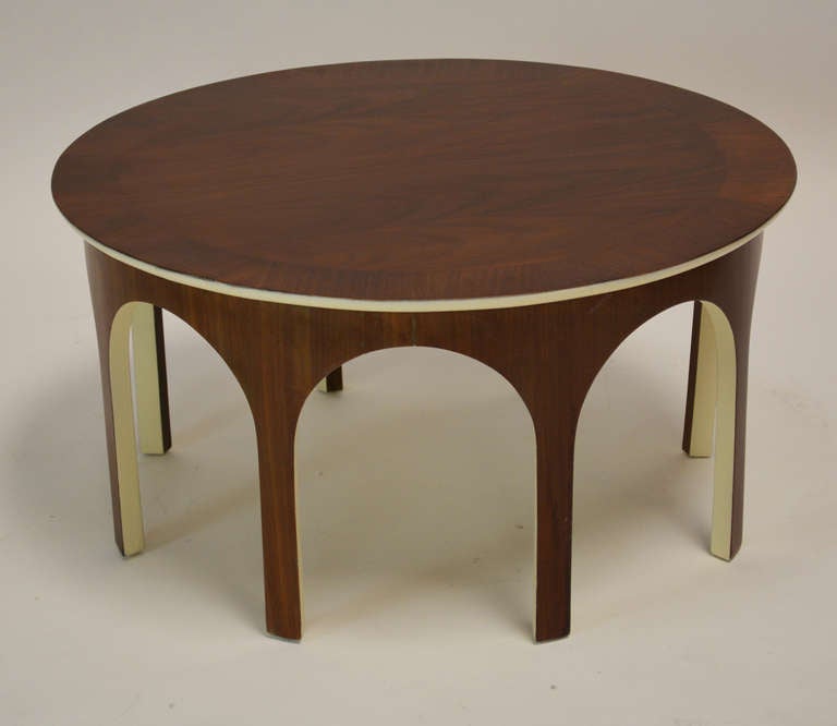 Rare walnut colosseum cocktail table accented with ivory lacquer. Recently refinished and repainted.