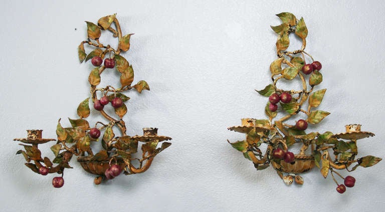 Early 20th Century Italian tole candle sconces of branches with cherries and leaves. Not wired.