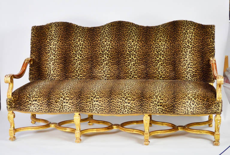 A lovely sofa or settee in the Regence style with carved gilt wood arms, legs and 