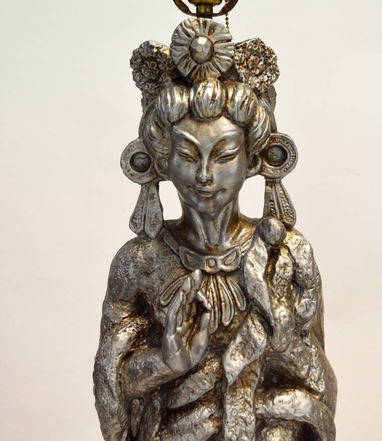 A pair of large scale plaster lamps with antiqued silver finish in the form of a Asian  figure / Kwan Yin. Great sculptural quality to the piece. 38'' to top of socket, 34.5'' to top of plaster lamp. Shades not included, for display only.