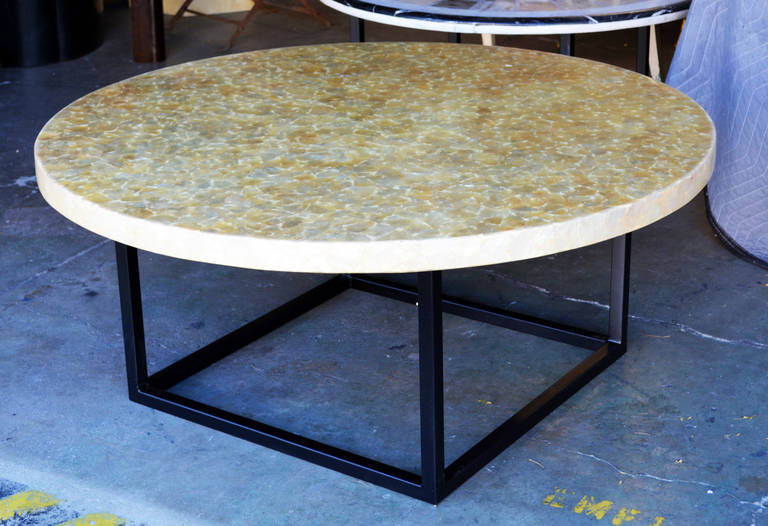 A vintage capiz shell table top on a new metal base.  2