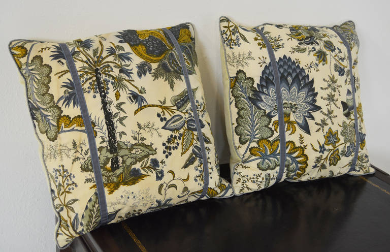 Newly made pillows with 1950s vintage printed cotton fabric in a Jacobean pattern in blue, grey and mustard green on an ivory ground. Hand closed with Samuel & Sons trim and cotton velvet backs; 50% down/ 50% feather custom pillow inserts.