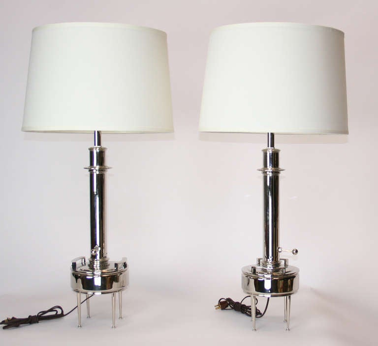 Wonderful pair of Stiffel lamps newly plated in polished nickel.
Modernist oil lamp form on four tapered legs. Newly rewired. Shades for display only.