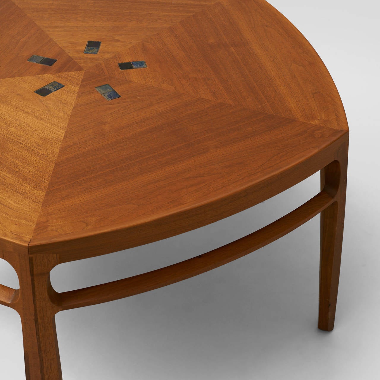Edward Wormley, pentagonal coffee table
A pentagonal coffee table of mahogany (model 5625T) by Edward Wormley for Dunbar. Features a star burst of Tiffany Studios Favrile glass tiles on the table top. Marked with a rectangular brass Dunbar tag: