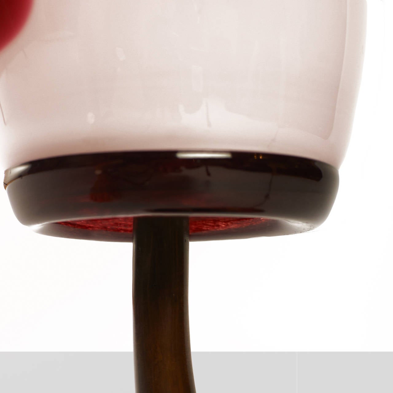 A unique prototype lamp designed by Jordan Mozer for Port House, a
restaurant in Biloxi, Mississippi. Cast bronze base and handblown glass shade topped with an interesting finial.