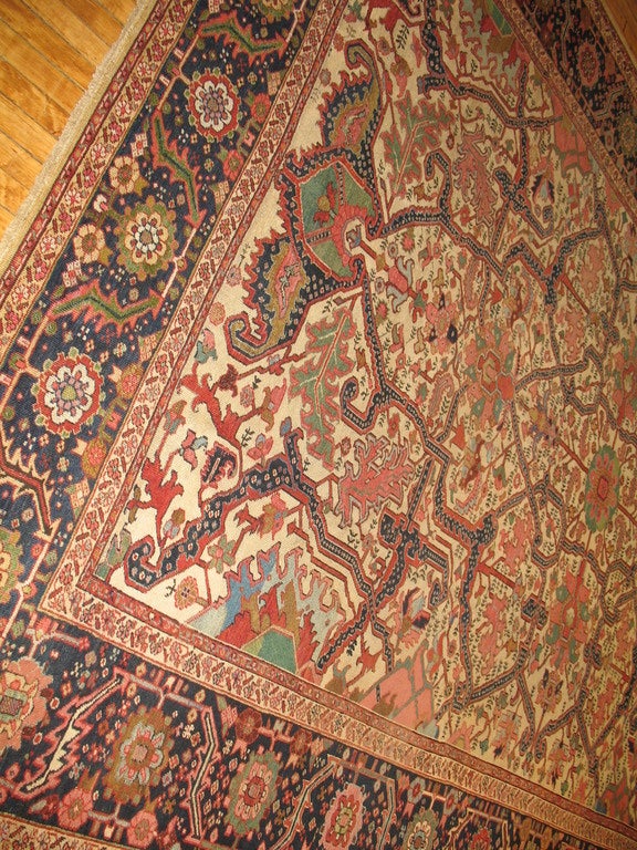 Persian Ivory Field Antique Heriz Serapi Rug For Sale