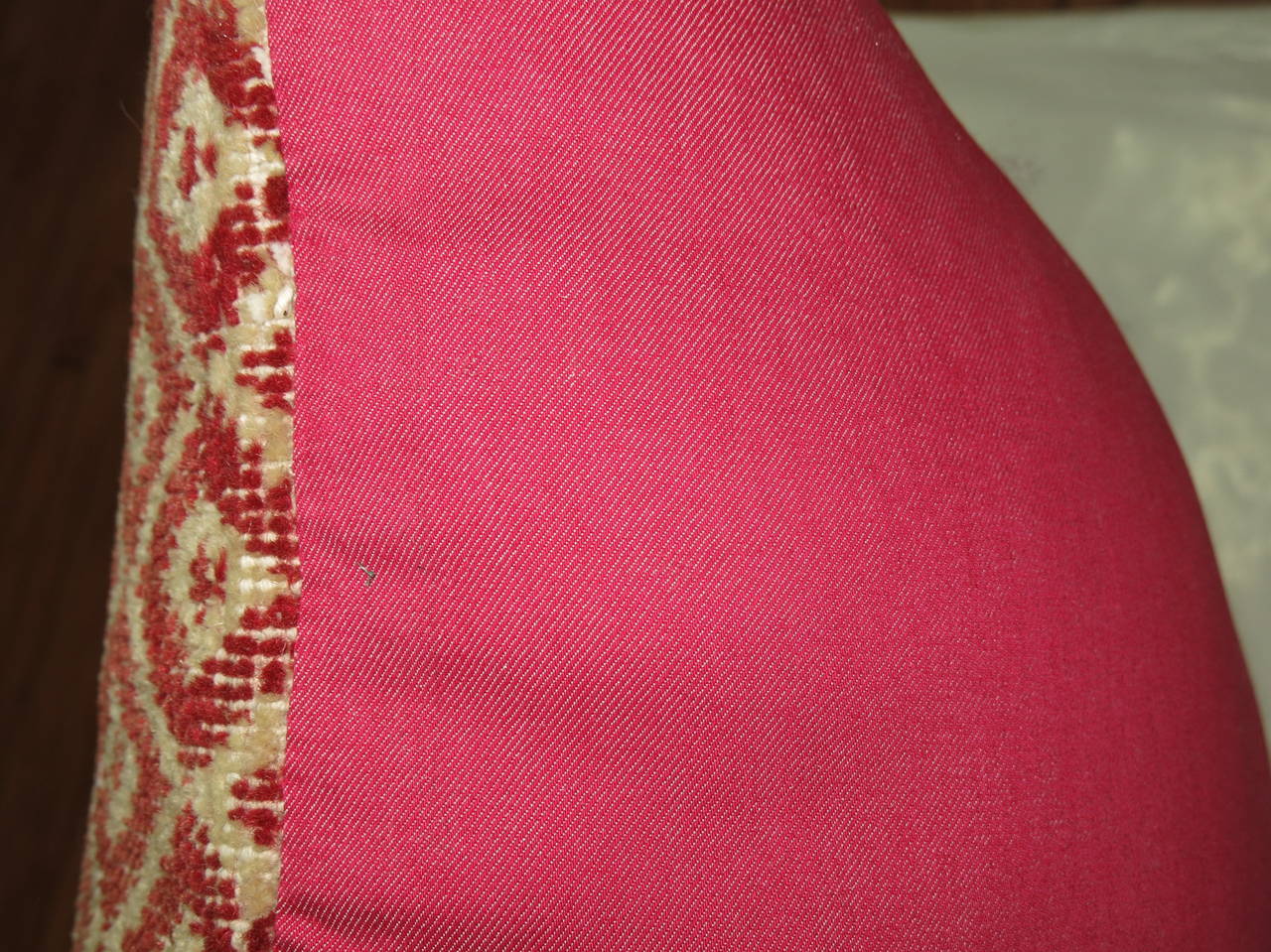 Large pillow made from a vintage Turkish Konya rug in ivory and crimson red. Backed In pink cotton
 
Measures: 24