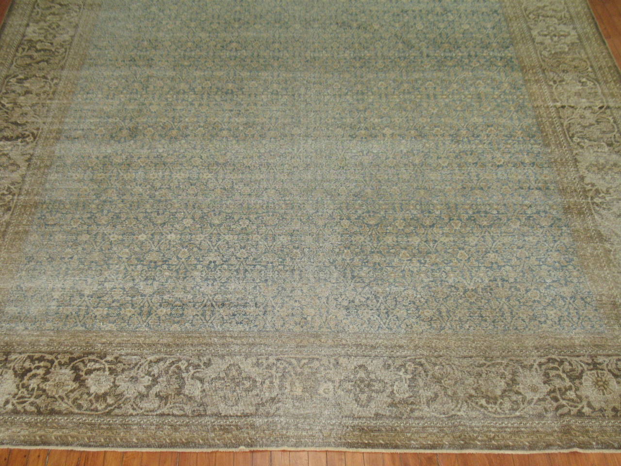 Late 19th century light blue Persian Tabriz rug with an all-over Herati motif.