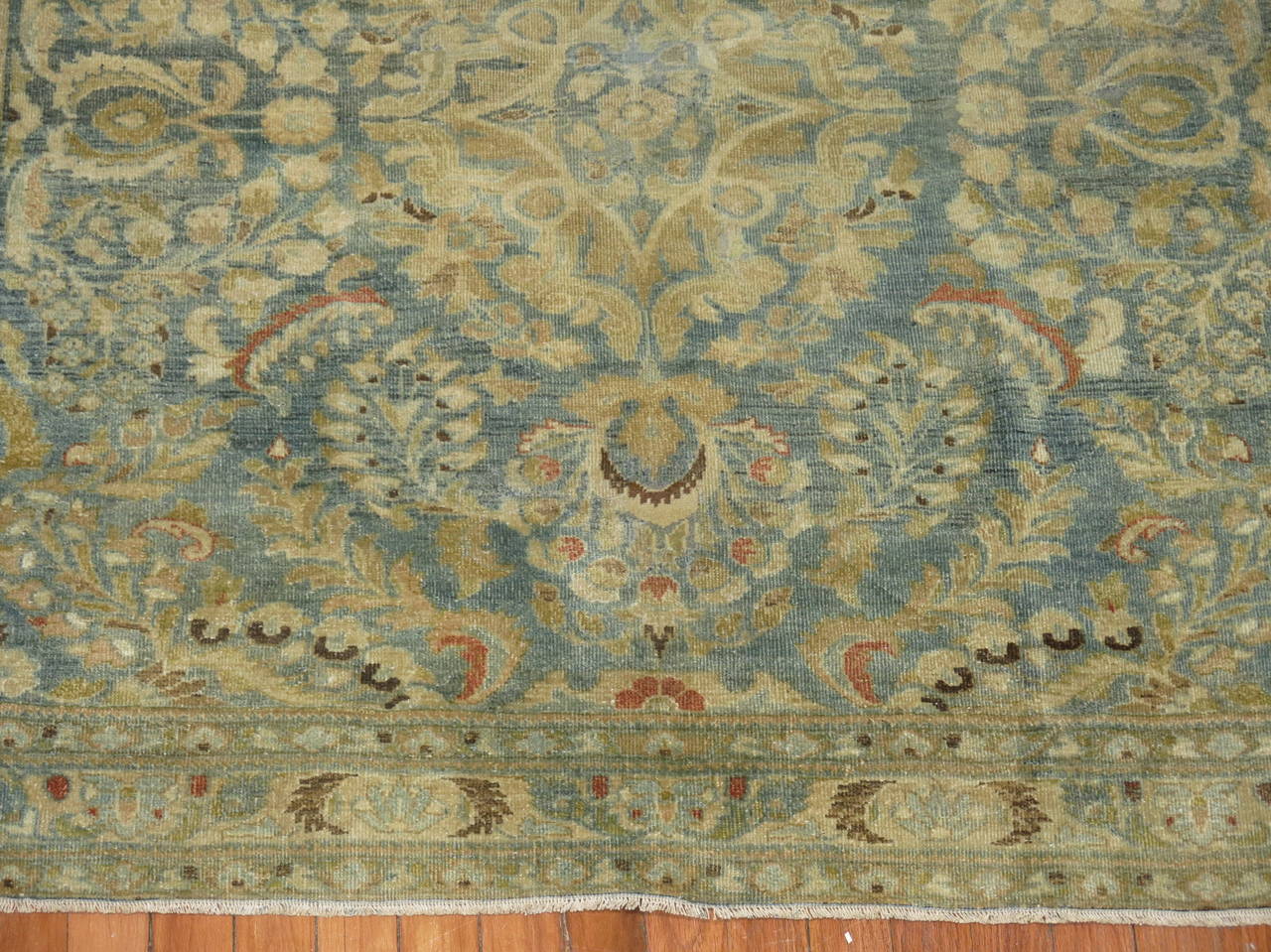 A rare size early 20th century Persian rug with a predominant aqua blue tone, circa 1920.

Measures: 4'4'' x 4'8''.