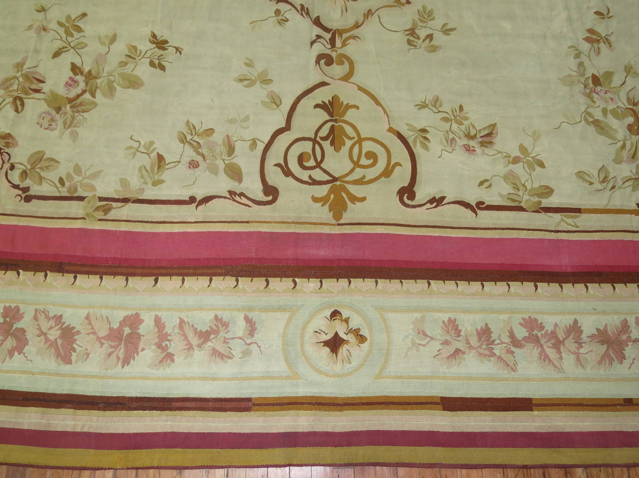 Classic 18th century French Aubusson with an ivory ground. Accents in pink and brown. Overall very good condition.

Size: 13'5” wide x 20'7” long

Aubusson rugs take its name from the French town Aubusson, lying on the banks of the Creuse River.
