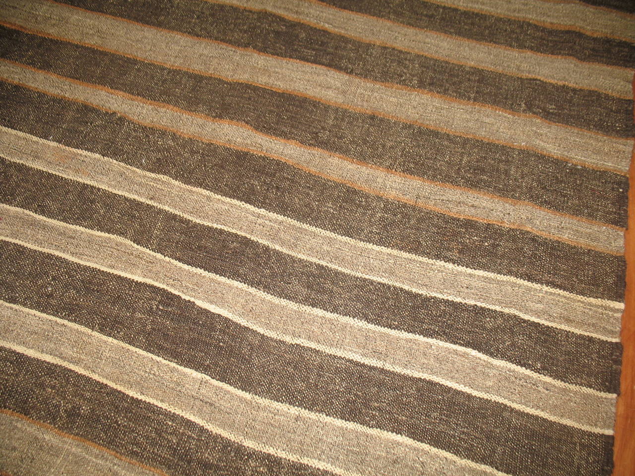 A vintage modernist Kilim, gray, brown and peach accents.