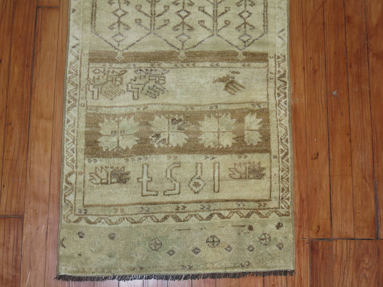 Narrow Mid-Century Turkish Oushak runner. Accents in cream and brown.