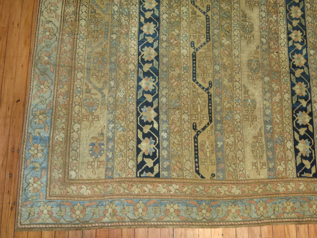 A fine gallery size late 19th century Karabagh rug with an unusual all-over design of narrow vertical stripes in powder blue, steel blue, ivory, caramel and beige containing floral Meander, scrolling vinery, and geometric motifs within a powder blue