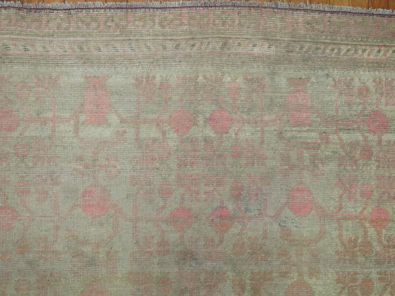 An early 20th century Decorative Khotan rug, shades of silver and pink.