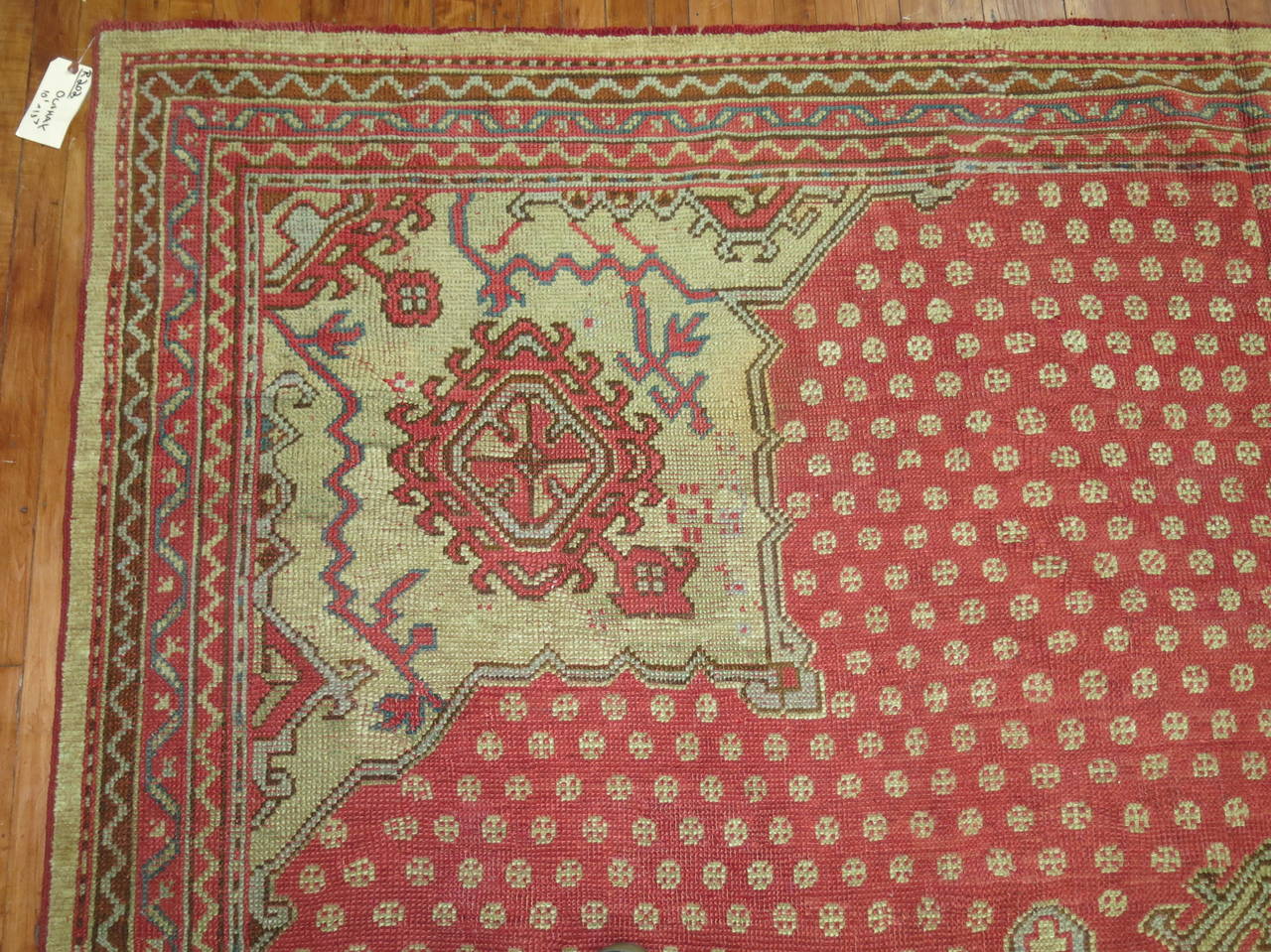 An early 20th century antique Turkish Oushak rug.

10'1'' x 13'7''