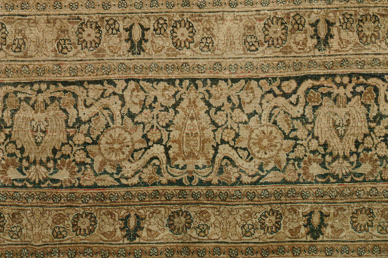 A stunning oversized classical fine Persian rug that would look incredible in any formal setting. Ivory, charcoal, cocoa's and cinnamon color accents makes this piece glimmer. Extremely fine quality with a thin nap. Sparkling abrashes in various