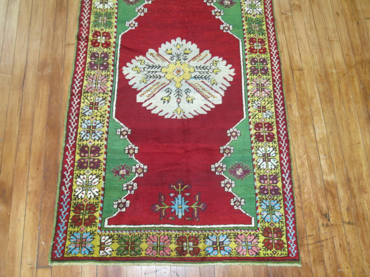 A jewel-toned turn of the 20th century Turkish runner.

Measures: 3'4'' x 12'3''.