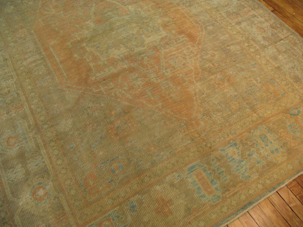 A lovely turkish oushak with aqua blue, camel, and soft oranges. Medallion is off-center giving it more of a unique look.

Check out our full collection of One Of a kind Reproductions. http://www.jdorientalrugs.com/inventory.cfm?catid=14